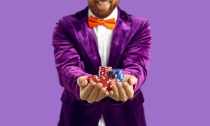 Close,Up,Of,Poker,Chips,In,Hands,Of,Joyful,Excited